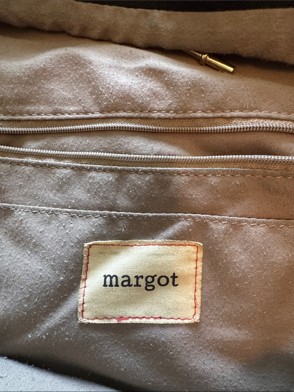 margot leather  backpack gold trim zip